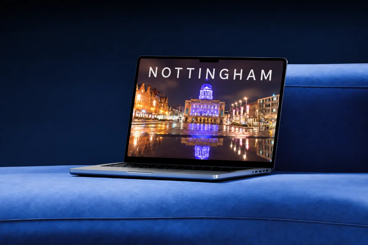 Laptop showing Nottingham Council House lit up at night in Old Market Square